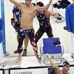Phelps is ecstatic, while Lezak pumps his while in the water.